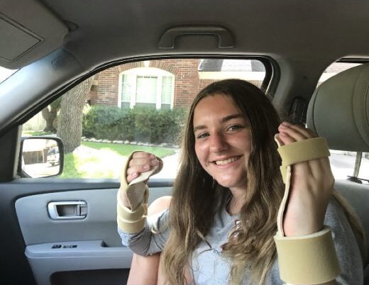 Jacilyn Averill poses with her hand splints after her diagnosis.