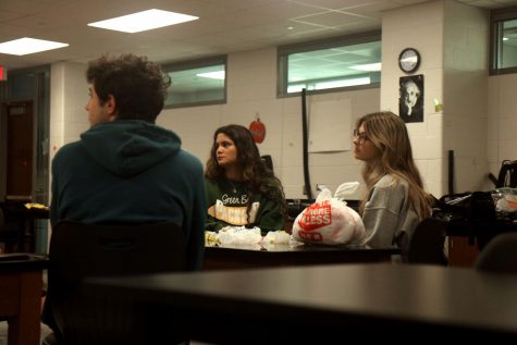 Environmentalist Club members look attentively during a presentation.