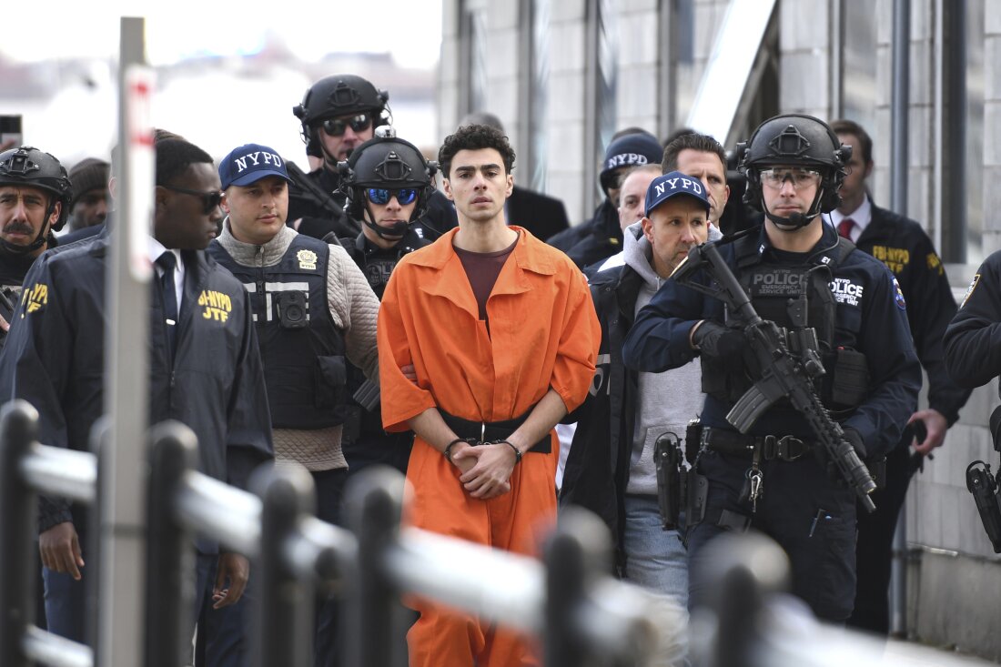 Luigi Mangione, a suspect in the fatal shooting of UnitedHealthcare CEO Brian Thompson, is escorted by police, Thursday, Dec. 19, 2024, in New York. (AP Photo/Pamela Smith)