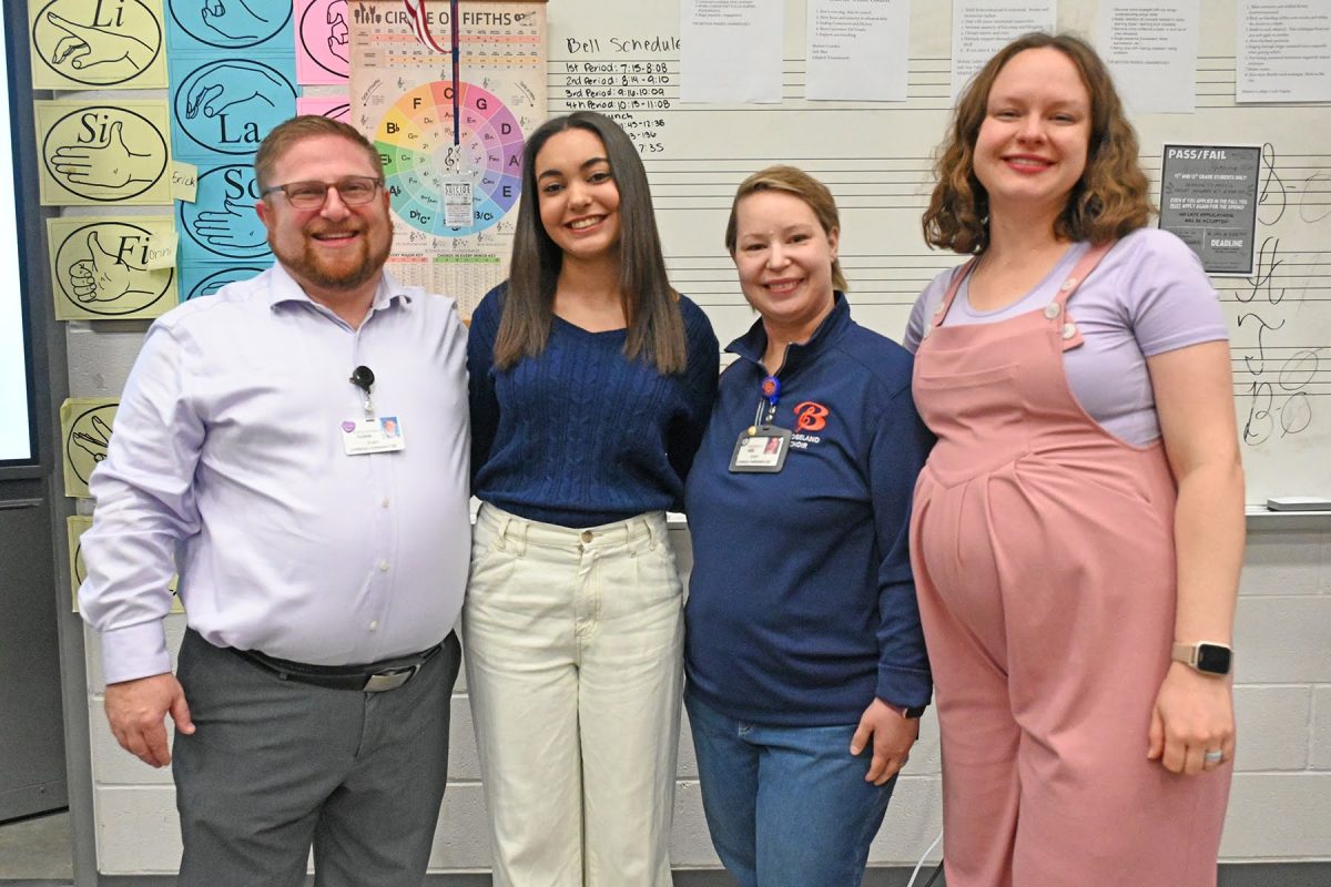 Leah Grigsby (12) with her choir directors after recieving the TMEA scholarship. 