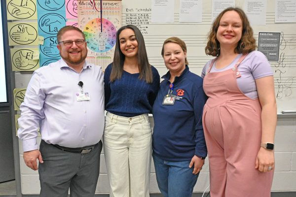 Leah Grigsby (12) with her choir directors after recieving the TMEA scholarship. 